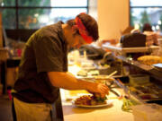 Vancouver chef David Mork prepares a plate. In 2008, he co-opened Lapellah in Vancouver. The restaurant  helped elevate Vancouver's fine-dining scene.