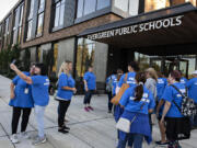 Members of the Evergreen Public School Employees large group union, also known as PSE #1948 make their way into Evergreen Public Schools headquarters on Tuesday afternoon. The union represents about 1,000 employees in the district.