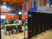 Portable walls form a classroom Tuesday in an auxiliary gym in Ridgefield. Ridgefield School District schools are converting extracurricular spaces into classrooms to alleviate crowding.