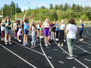 RIDGEFIELD: Twice a week after school, the View Ridge Middle School track fills with girls walking, jogging, and running toward achieving their personal goals as part of Ridgefield School District's "Girls Run the World" program.