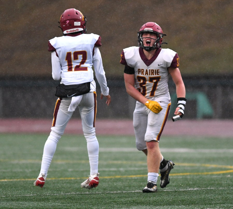 Prairie junior Pierson Lameh, right, lets out a yell after a sack Friday, Oct. 21, 2022, during the Falcons' 13-6 win against Evergreen at McKenzie Stadium.
