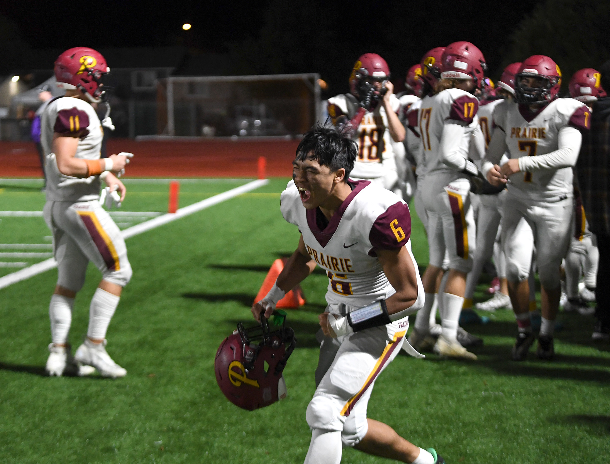 Prairie senior Nathan Phongphouvanh, center, lets out a yell Friday, Oct. 21, 2022, after the Falcons’ 13-6 win against Evergreen at McKenzie Stadium.