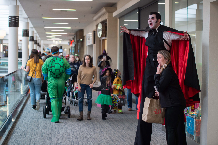 James Sharinghousen, a 7 1/2 -foot-tall vampire, menaces shoppers at the Vancouver Mall early Saturday afternoon. Booville, hosted by the Parks Foundation of Clark County and sponsored by iQ Credit Union, brought hundreds of excitedly ghoulish children and their parents to trick-or-treat at the mall.