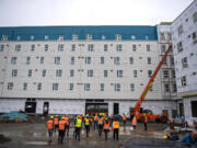 Gov. Jay Inslee joins a tour of the Fourth Plain Community Commons mixed-use building project on Oct. 23. The project will offer 106 affordable housing units and is on track to open in summer 2023.