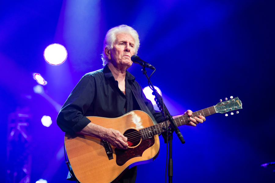 Graham Nash performs on stage during the Cambridge Folk Festival in 2019 in Cambridge, England.