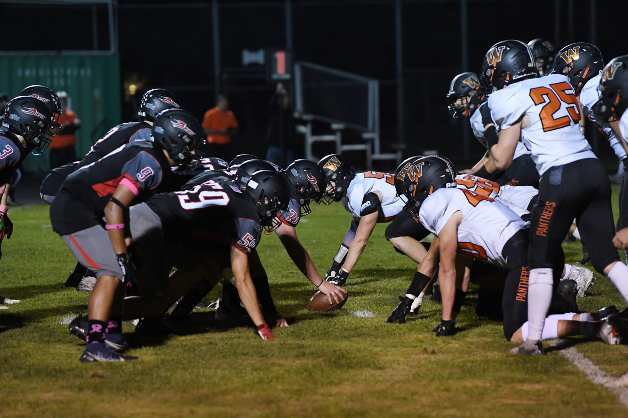 The defensive line of Washougal gets ready for the snap from R.A. Long during Friday’s 2A Greater St. Helens League game at Longview Memorial Stadium.