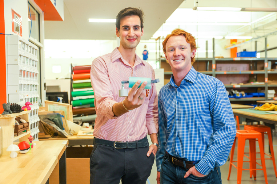 Southern Methodist University students Raleigh Dewan, left, and Mason Morland with the SteadiSpoon, an invention to help patients with Parkinson's disease eat smoothly by mechanically counteracting hand tremors, in a lab space at the university in Dallas.