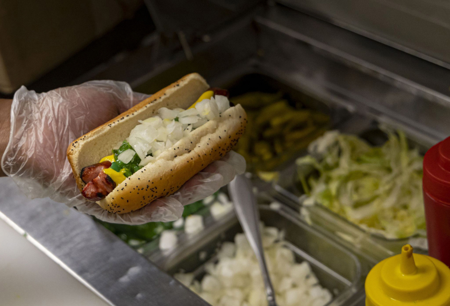 A char dog is prepared with all the toppings on Oct. 5 at The Wiener's Circle in Chicago's Lincoln Park.