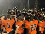 Washougal players celebrate on the field after defeating Hockinson and finishing 7-0 in the 2A Greater St. Helens League on Oct. 28, 2022, at Fishback Stadium in Washougal.