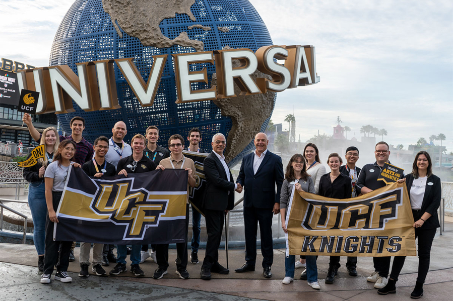 The University of Central Florida's Themed Experience master's program and Universal Creative announced a new course starting spring 2023 that allows students to study entertainment and design at Universal Orlando Resort. Here, students pose with UCF Themed Experience Program Director Peter Weishar, center left, and Universal Creative President Mike Hightower, center right.