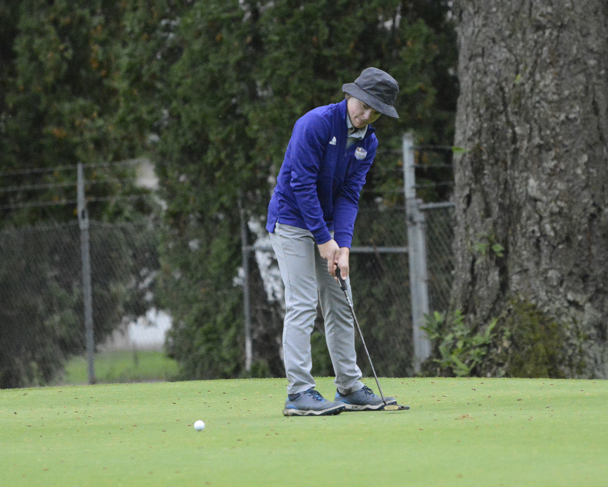 Columbia River’s Noah Larson putts on the No. 5 green at Orchard Hills Golf Club in Washougal during a playoff at the Class 2A District 4 golf tournament on Tuesday, Oct.