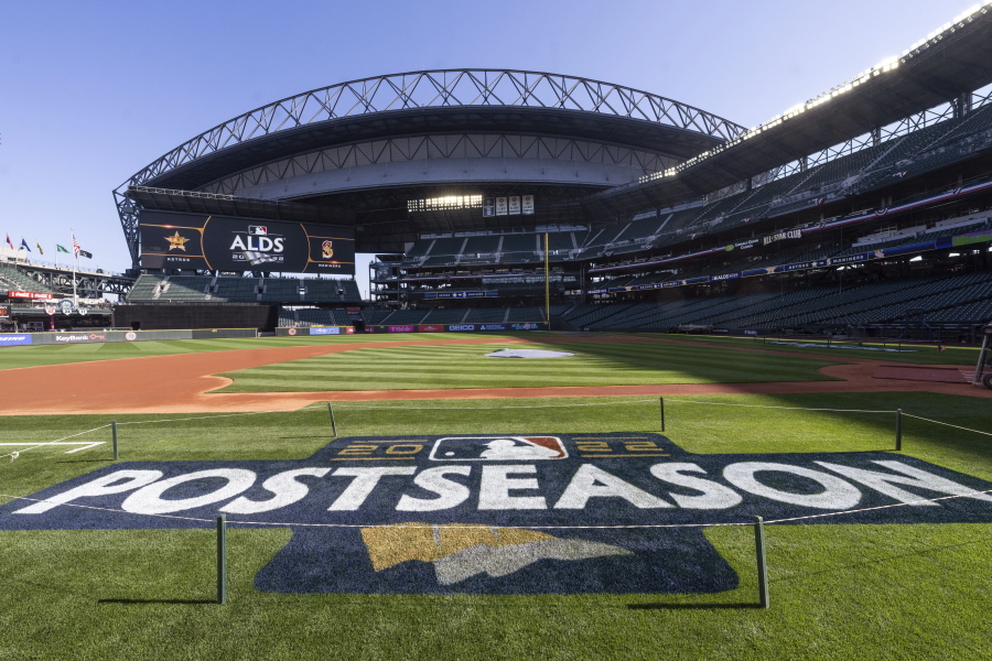 A logo for the baseball playoffs is on the field Friday, Oct. 14, 2022, the day before Game 3 of an AL Division Series between the Houston Astros and the Seattle Mariners in Seattle.