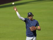 Seattle Mariners starting pitcher Logan Gilbert throws during a workout ahead of Game 1 of baseball's American League Division Series, Monday, Oct. 10, 2022, in Houston. The Mariners will play the Houston Astros Tuesday. (AP Photo/David J.