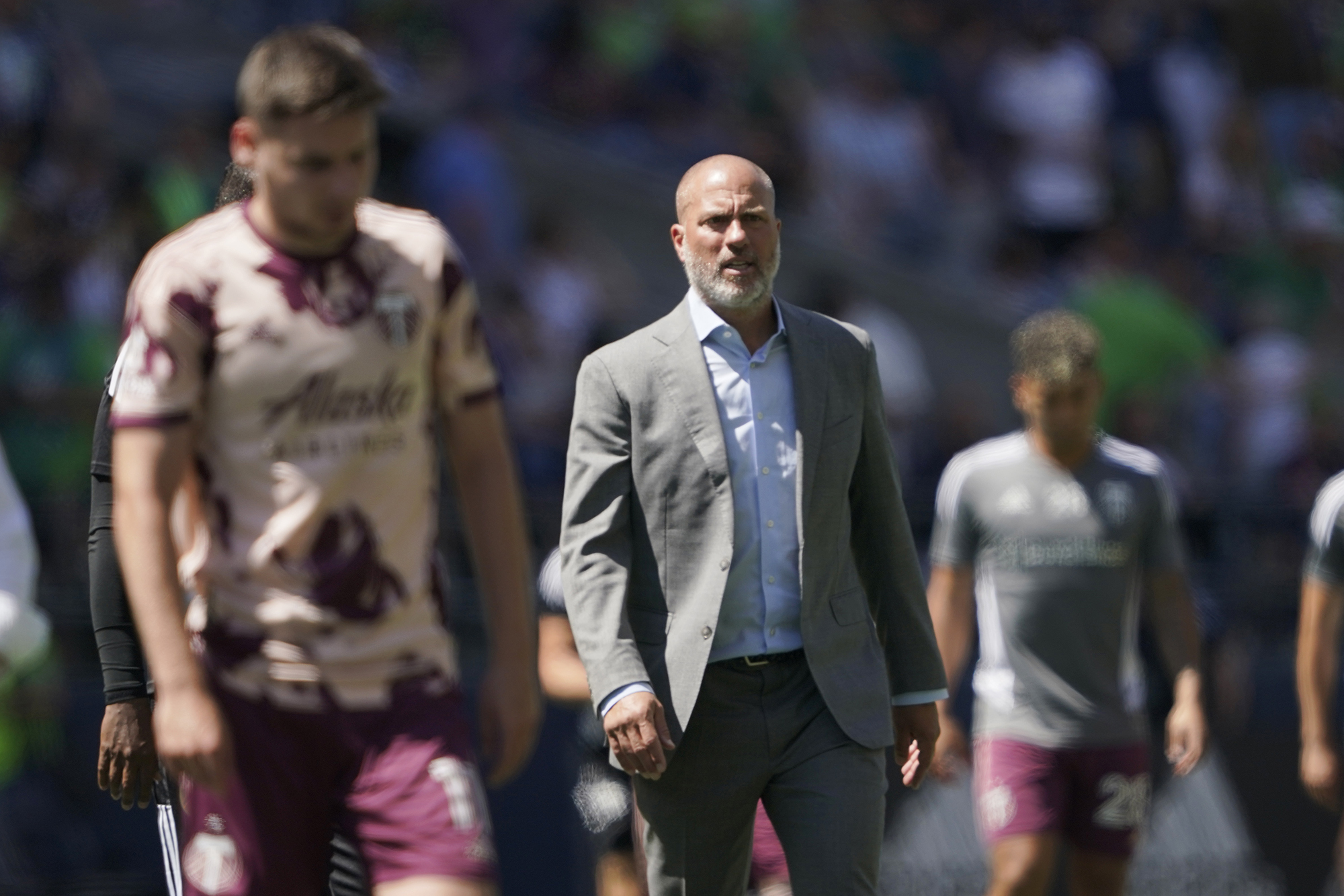 Portland Timbers head coach Giovanni Savarese walks off the pitch with his team after the first half of an MLS soccer match against the Seattle Sounders, Saturday, July 9, 2022, in Seattle. (AP Photo/Ted S.