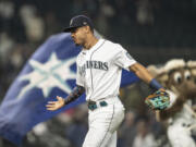 Seattle Mariners' Julio Rodriguez celebrates after the second baseball game of the team's baseball doubleheader against the Detroit Tigers, Tuesday, Oct. 4, 2022, in Seattle. The Mariners won 9-6.