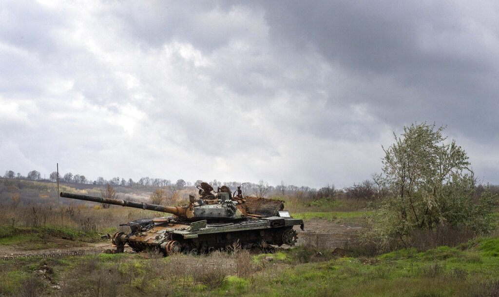 A Russian tank damaged in recent fighting is seen in the field near the recently retaken village of Kamianka, Kharkiv region, Ukraine, Sunday, Oct. 30, 2022.