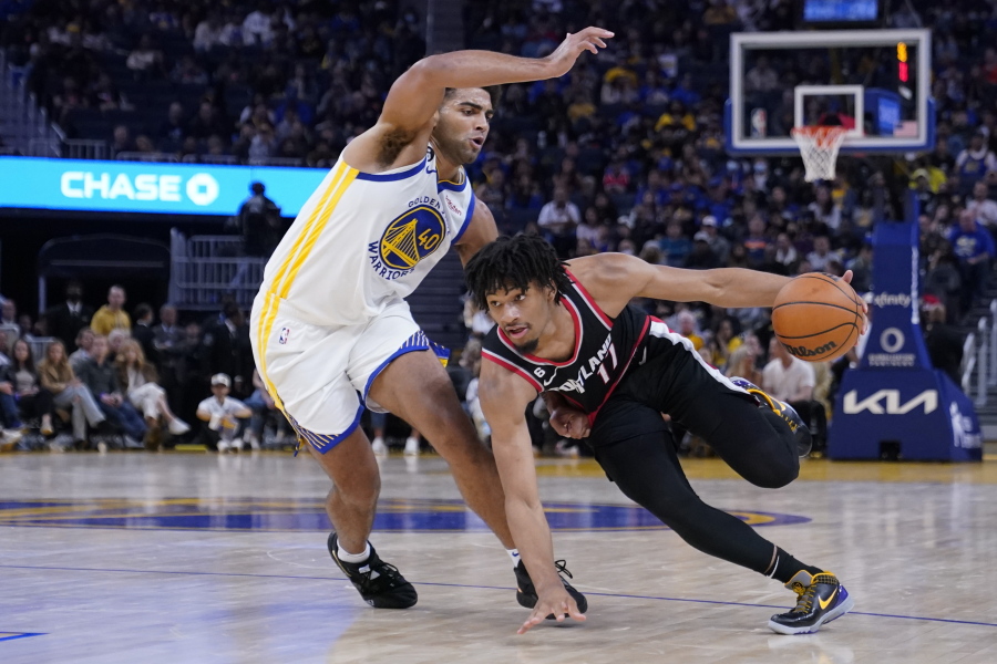 Portland Trail Blazers guard Shaedon Sharpe (17) drives to the basket against Golden State Warriors forward Anthony Lamb (40) during the first half of an NBA preseason basketball game in San Francisco, Tuesday, Oct. 11, 2022. (AP Photo/Godofredo A.