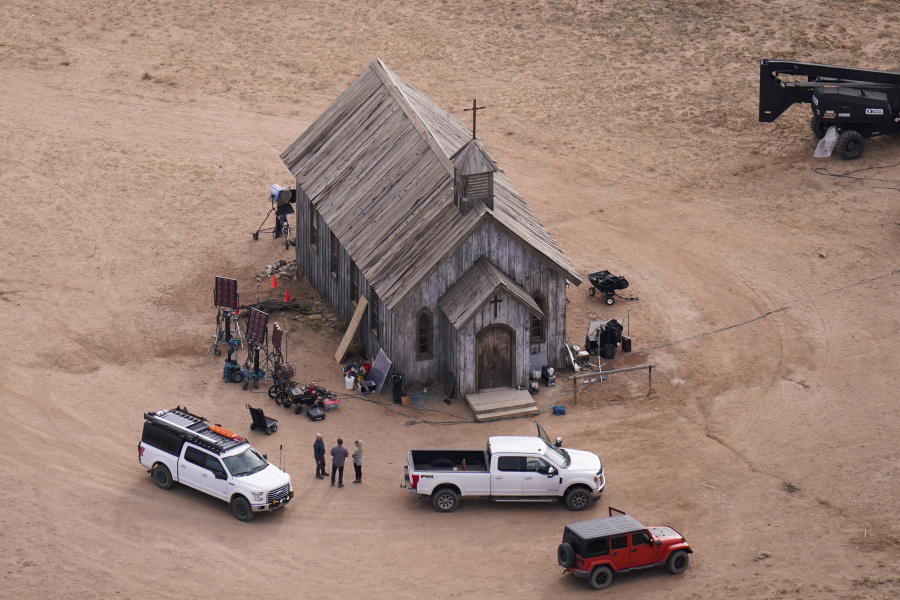 FILE - This aerial photo shows part of the Bonanza Creek Ranch film set in Santa Fe, N.M., on Saturday, Oct. 23, 2021, where cinematographer Halyna Hutchins died from a gun fired by actor Alec Baldwin. The family of a cinematographer shot and killed by Alec Baldwin on the set of the film "Rust" has agreed to settle a lawsuit against Baldwin and the movie's producers, and production will resume on the project. (AP Photo/Jae C.