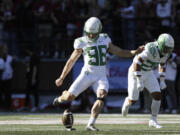 Oregon kicker Andrew Boyle (98) kicks the ball during the second half of an NCAA college football game against Washington State, Saturday, Sept. 24, 2022, in Pullman, Wash.
