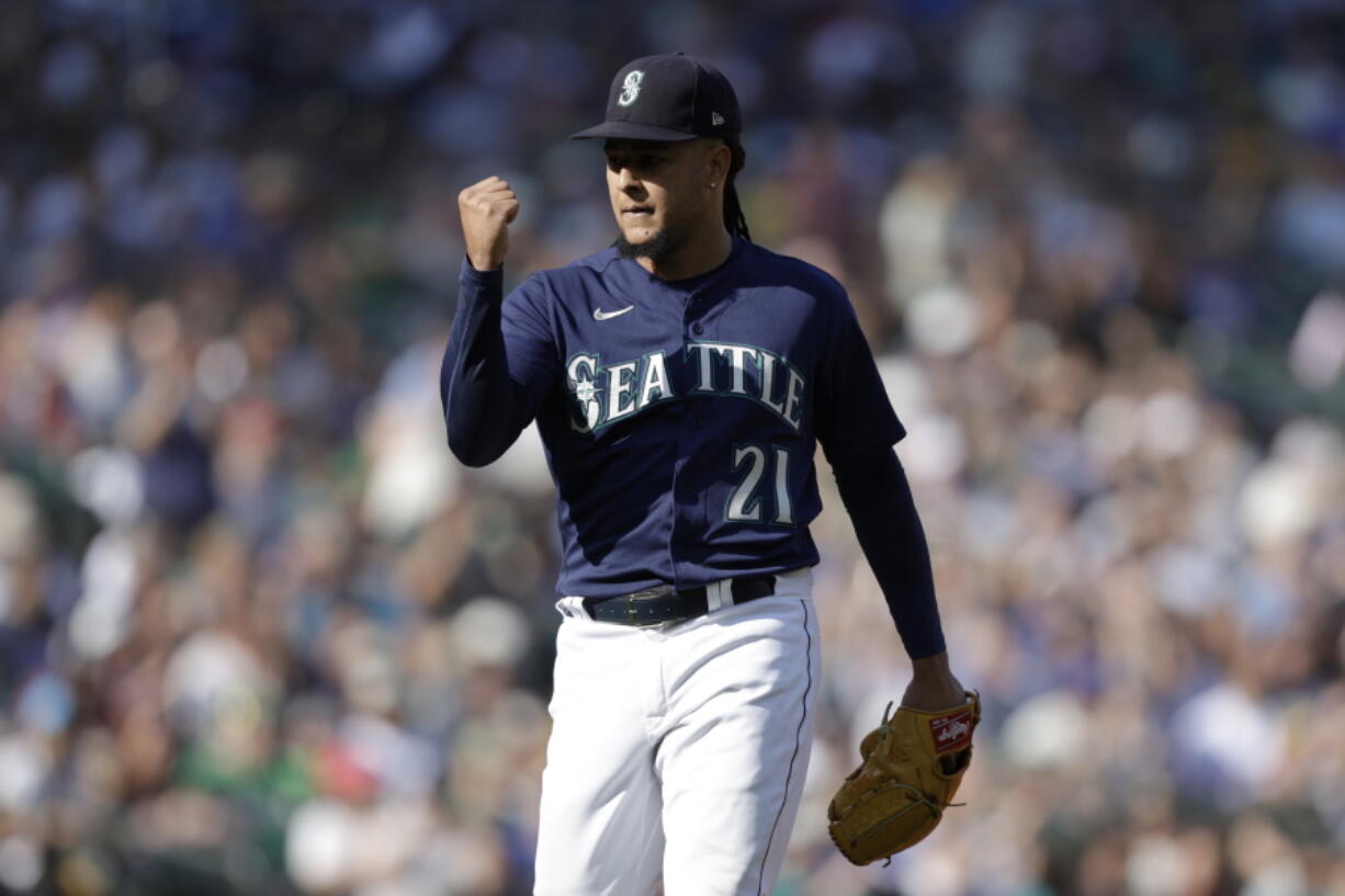 Seattle Mariners starting pitcher Luis Castillo pumps his fist after pitching against the Oakland Athletics in the fifth inning of a baseball game, Saturday, Oct. 1, 2022, in Seattle.