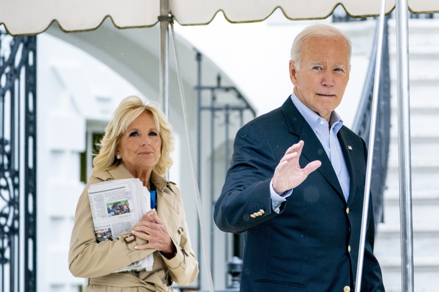 President Joe Biden and first lady Jill Biden walk out of the White House to board Marine One in Washington, Monday, Oct. 3, 2022, for a short trip to Andrews Air Force Base, Md., and then on to Puerto Rico.