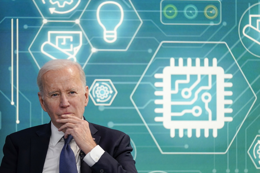 FILE - President Joe Biden attends an event to support legislation that would encourage domestic manufacturing and strengthen supply chains for computer chips in the South Court Auditorium on the White House campus, March 9, 2022, in Washington. Biden is working to create a manufacturing revival, even helping to put factory jobs in Republican territory under the belief it can restore faith in U.S. democracy.