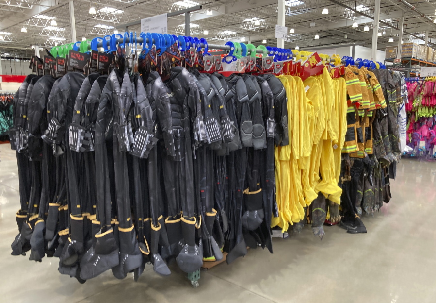 Costumes for Halloween hang from racks Oct. 14 in a Costco warehouse in Sheridan, Colo.