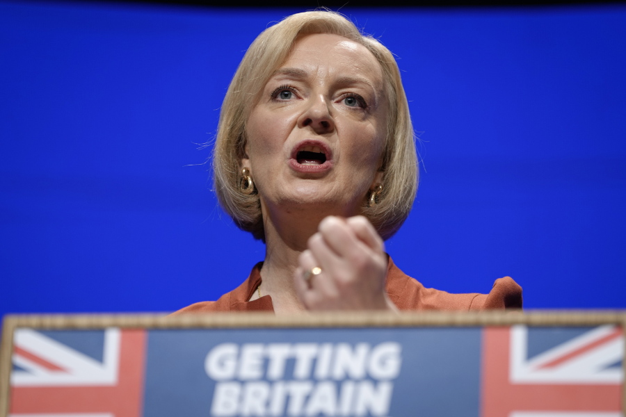 FILE - Britain's Prime Minister Liz Truss makes a speech at the Conservative Party conference at the ICC in Birmingham, England, Oct. 5, 2022. After an acrimonious divorce and years of bickering, Britain's government looks like it wants to make up with the European Union. On Thursday, Oct. 6 Truss travels to the Czech Republic to attend the first meeting of the European Political Community, an initiative of French President Emmanuel Macron that brings together EU members and countries outside the union.
