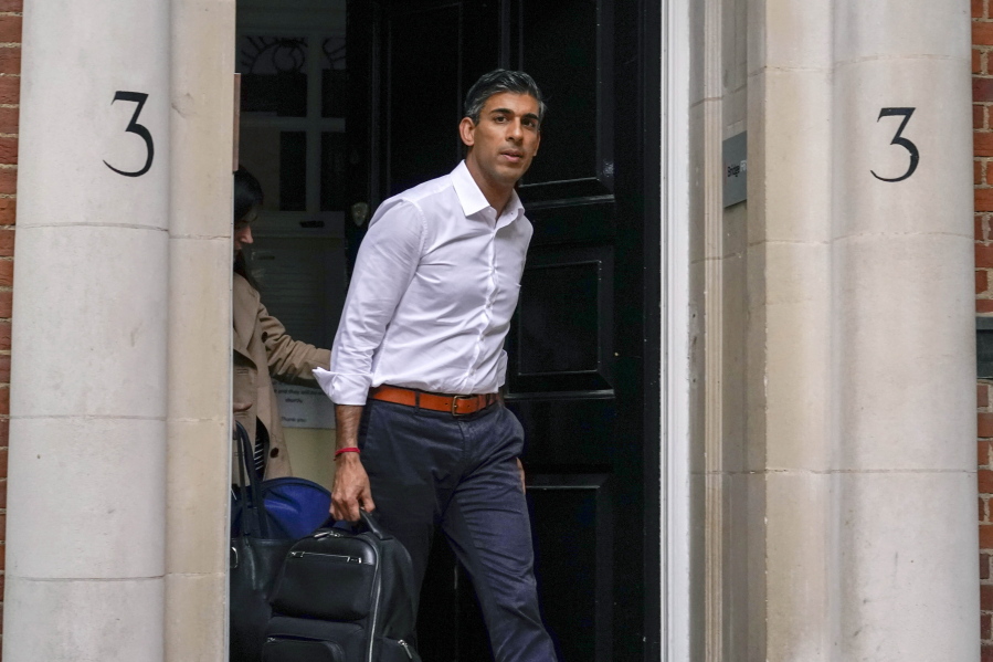 Conservative Party leadership candidate Rishi Sunak leaves his campaign office, in London, Sunday, Oct. 23, 2022.  Former British Treasury chief Rishi Sunak is frontrunner in the Conservative Party's race to replace Liz Truss as prime minister. He has garnered support from over 100 Tory lawmakers to forge ahead of his two main rivals: ousted former Prime Minister Boris Johnson and ex-Cabinet minister Penny Mordaunt. But widespread uncertainty remained after British media reported that Sunak held late-night talks with Johnson on Saturday.