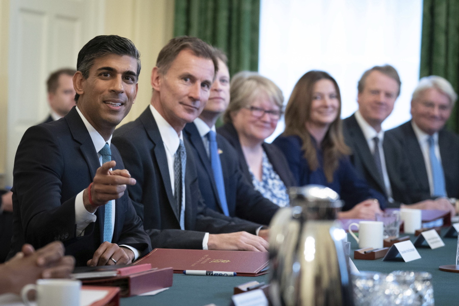 Britain's Prime Minister Rishi Sunak, left, alongside the Chancellor of the Exchequer, Jeremy Hunt, second left, holds his first Cabinet meeting in Downing street in London, Wednesday, Oct. 26, 2022.