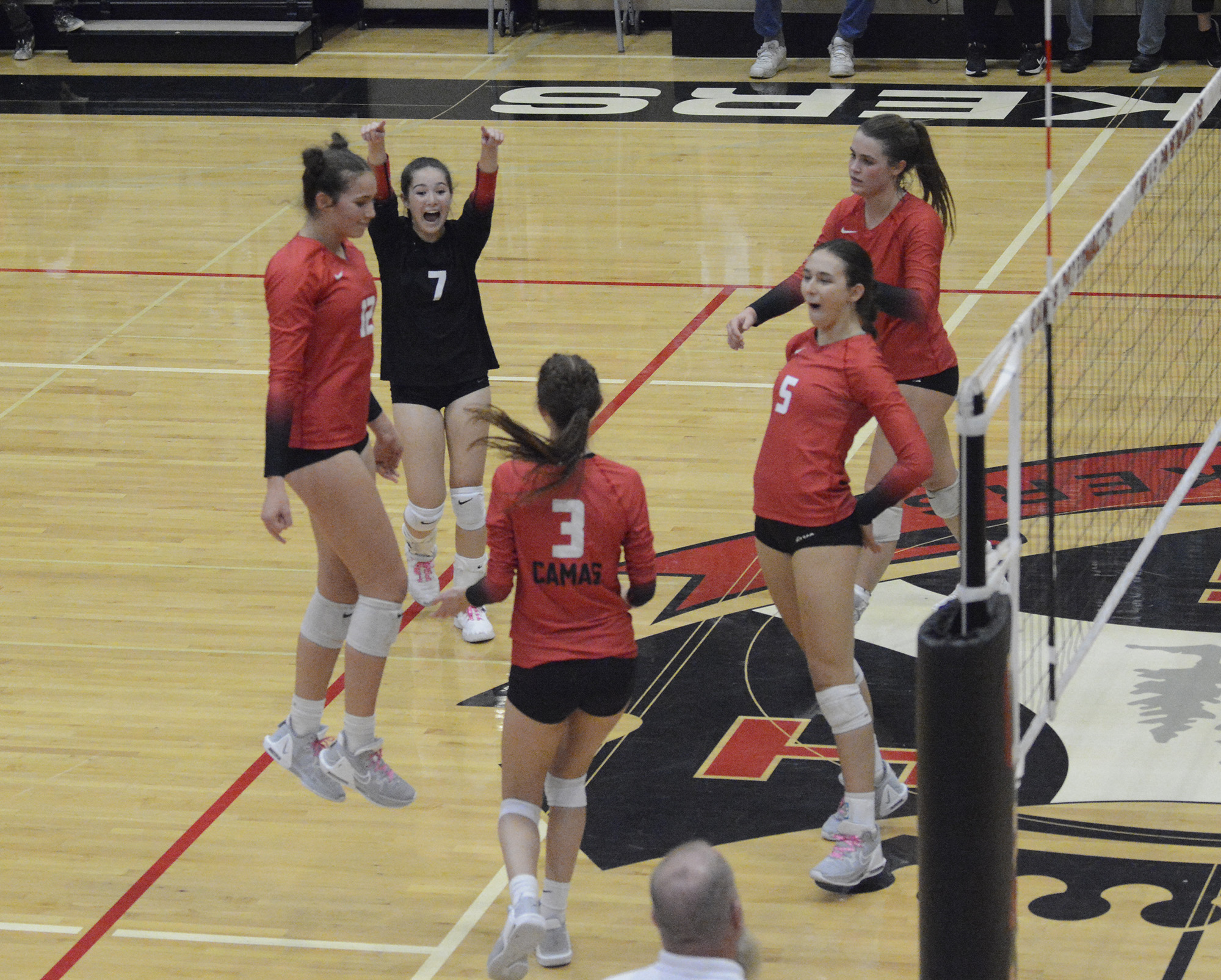 Members of the Camas volleyball team celebrate a point during the Papermakers' win over Skyview at Camas High School on Thursday, Oct. 27, 2022.