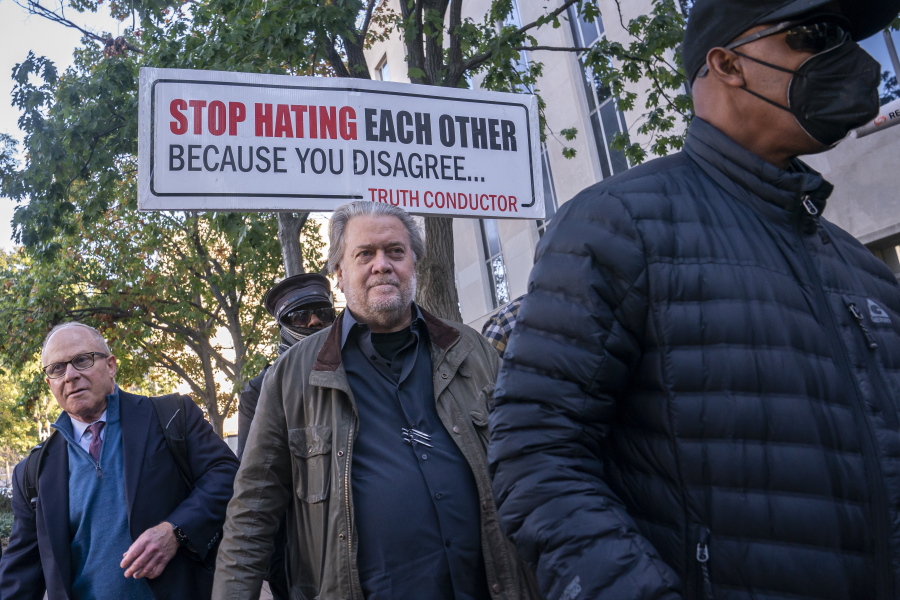 Steve Bannon, center, a longtime ally of former President Donald Trump, convicted of contempt of Congress, arrives at federal court for a sentencing hearing, Friday, Oct. 21, 2022, in Washington. Attorney David Schoen is left.