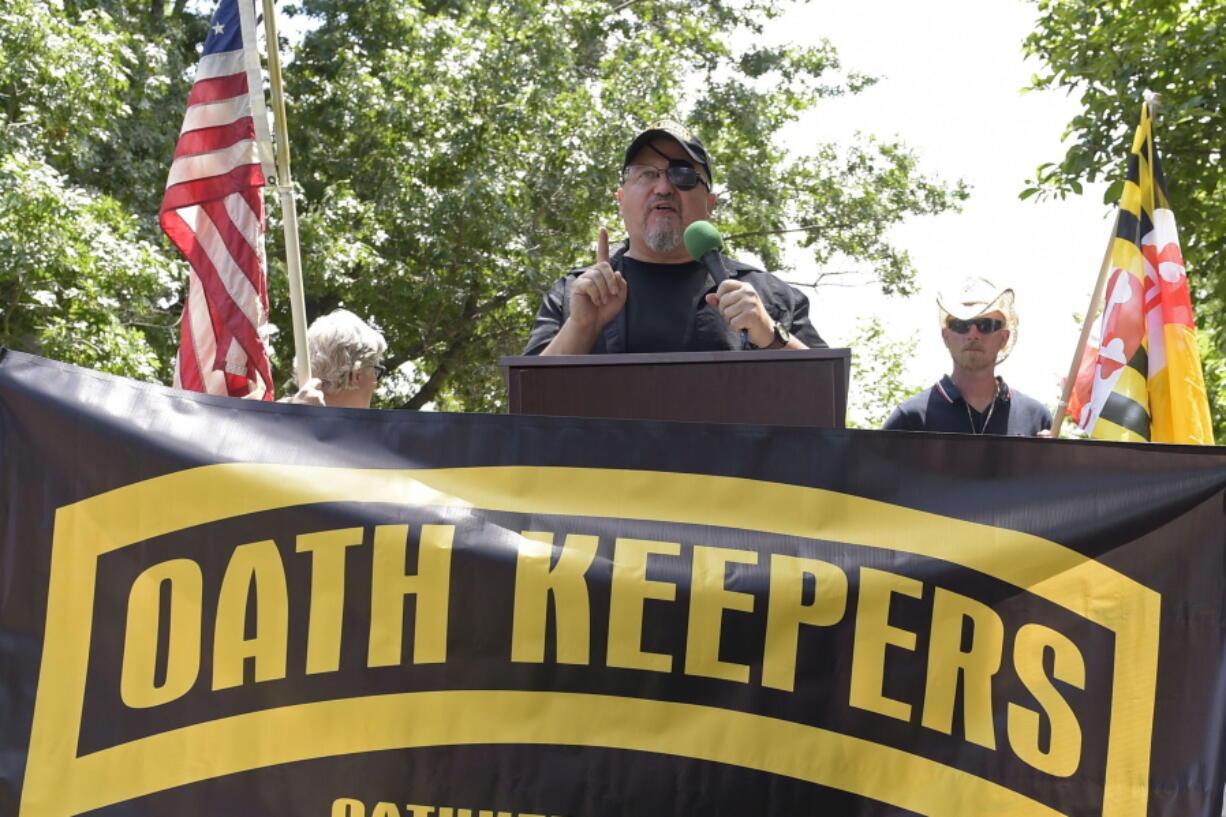 FILE - Stewart Rhodes, founder of the Oath Keepers, center, speaks during a rally outside the White House in Washington, June 25, 2017.  Federal prosecutors are preparing to lay out their case against the founder of the Oath Keepers' extremist group and four associates. They are charged in the most serious case to reach trial yet in the Jan. 6, 2021, U.S. Capitol attack. Opening statements are expected Monday in Washington's federal court in the trial of Stewart Rhodes and others charged with seditious conspiracy.