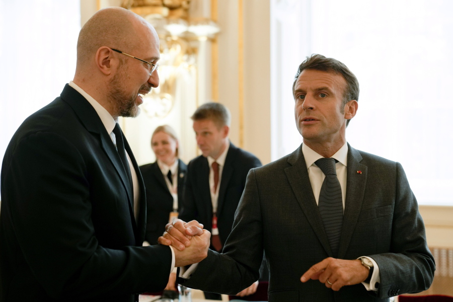 France's President Emmanuel Macron, right, speaks with Ukrainian Prime Minister Denys Shmyhal during a meeting of the European Political Community at Prague Castle in Prague, Czech Republic, Thursday, Oct 6, 2022. Leaders from around 44 countries are gathering Thursday to launch a "European Political Community" aimed at boosting security and economic prosperity across the continent, with Russia the one major European power not invited.