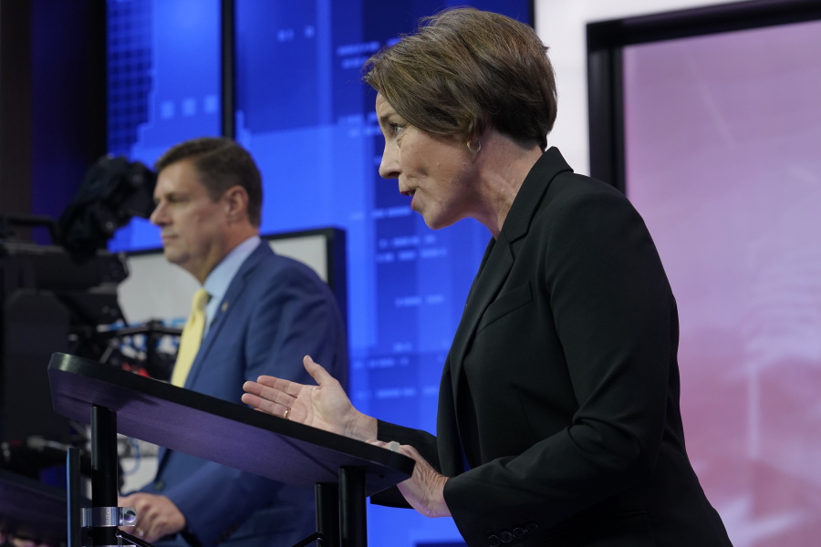 FILE - Gubernatorial candidates Massachusetts Democratic Attorney General Maura Healey, foreground, and Massachusetts Republican Geoff Diehl respond to questions during their televised debate, Wednesday, Oct. 12, 2022, at NBC10 television studios, in Needham, Mass. Healey is favored to become the first openly gay candidate elected as the state's governor.