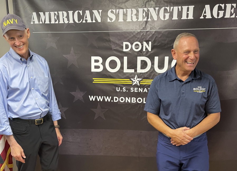 Sen. Rick Scott, R-Fla., chairman of the National Republican Senatorial Committee, campaigns alongside New Hampshire Republican Senate candidate Don Bolduc in Atkinson, N.H. on Sunday, Oct. 30, 2022.
