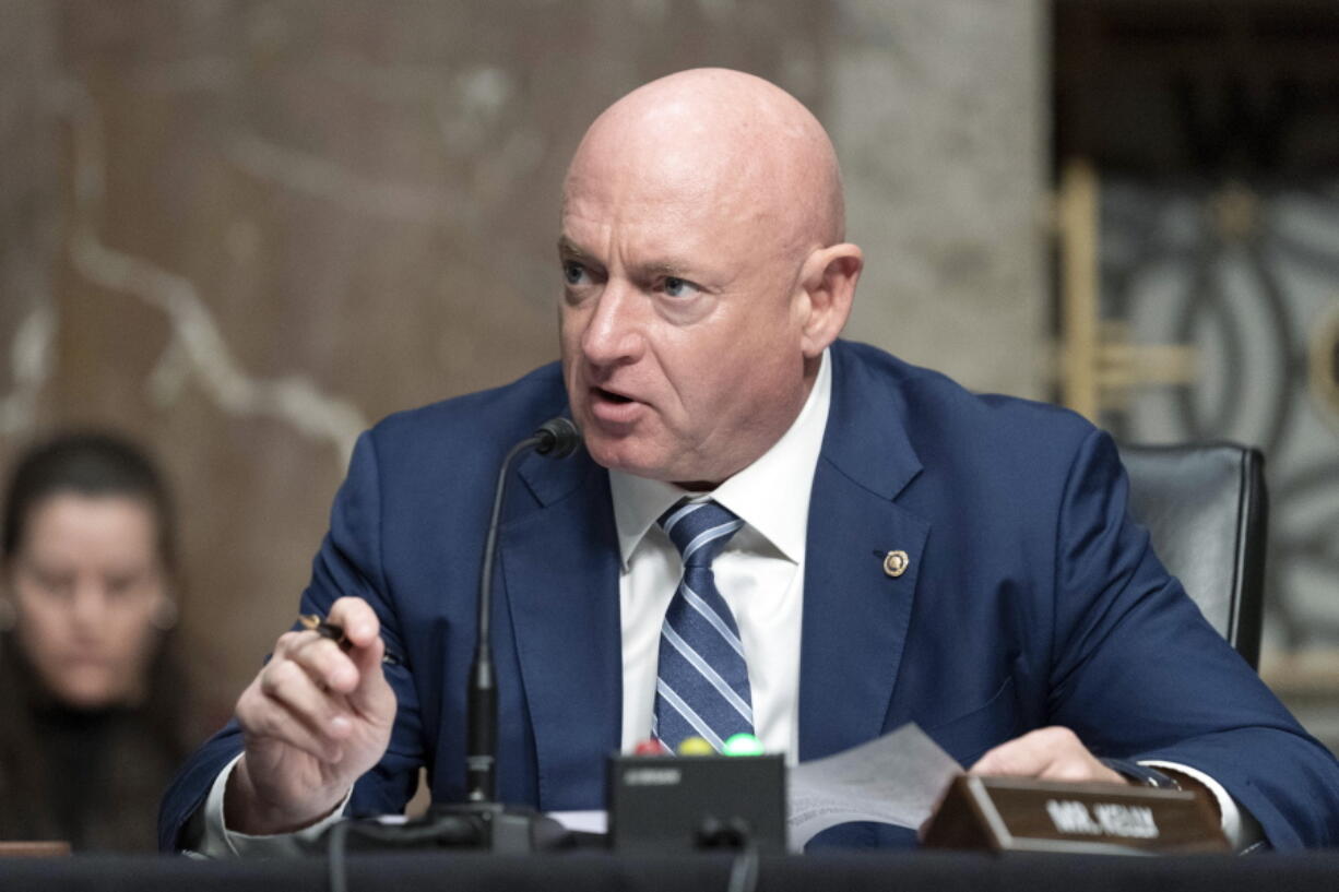 FILE - Sen. Mark Kelly, D-Ariz., speaks during a hearing of the Senate Armed Services Committee, on Capitol Hill, in Washington, March 24, 2022.  A year ago, Arizona's Democratic Secretary of State Katie Hobbs was all over cable news, building a national profile as a defender of democracy and raking in cash for her campaign for governor. Democratic Sen. Mark Kelly, newly elected to finish John McCain's last term and running for re-election, looked to be among the most vulnerable members of the Senate. Fortunes appear to have flipped for the two Democrats.