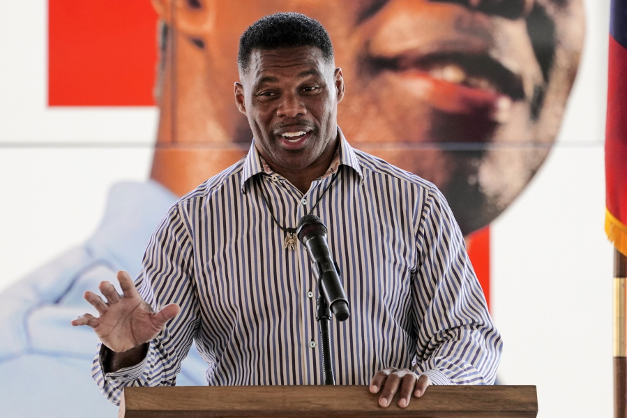 FILE - Republican candidate for U.S. Senate Herschel Walker speaks during a campaign stop in Dawsonville, Ga., Oct. 25, 2022. A woman came forward Wednesday, Oct.