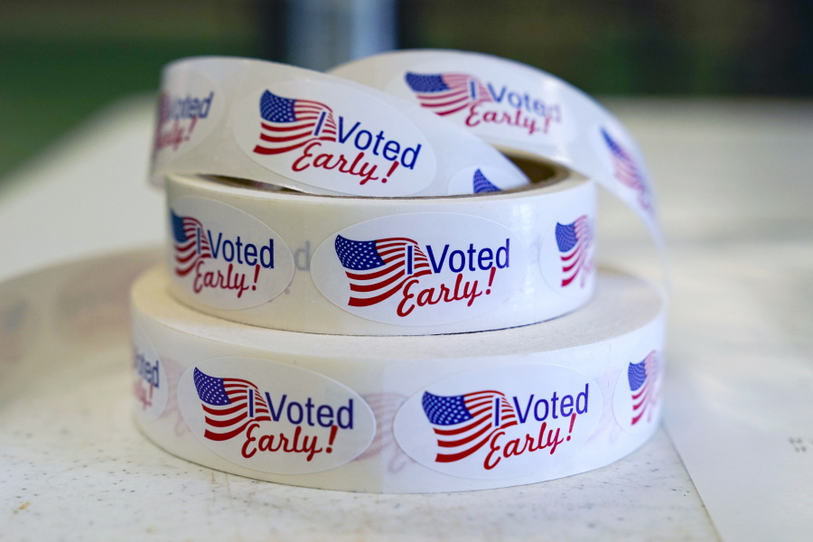 FILE - Rolls of "I Voted Early" stickers await voters in the final hours of early voting in the primary election in Noblesville, Ind., May 2, 2022. Election Day is still 12 days away. But in courtrooms across the country, efforts to sow doubt over the outcome have already begun.