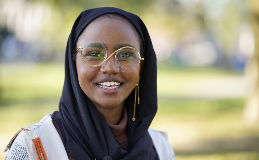Mana Abdi, 26, a Democratic candidate for state legislature, speaks with a reporter, Thursday, Oct. 6, 2022, in Lewiston, Maine. She is running unopposed. Her Republican opponent, who had posted on Facebook that Muslims "should not be allowed to hold public office," withdrew from the race in August. (AP Photo/Robert F.