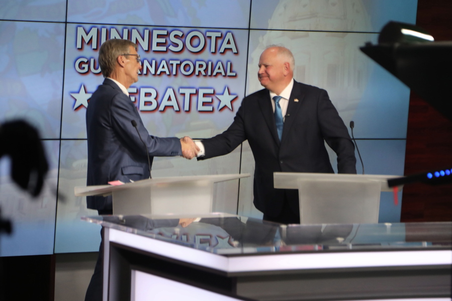 Minnesota Republican gubernatorial candidate Scott Jensen, left, and Democratic Gov. Tim Walz, shake hands before their debate at the studios of KTTC-TV in Rochester, Minn., on Tuesday night, Oct. 18. 2022. It was their only scheduled televised debate of the campaign.