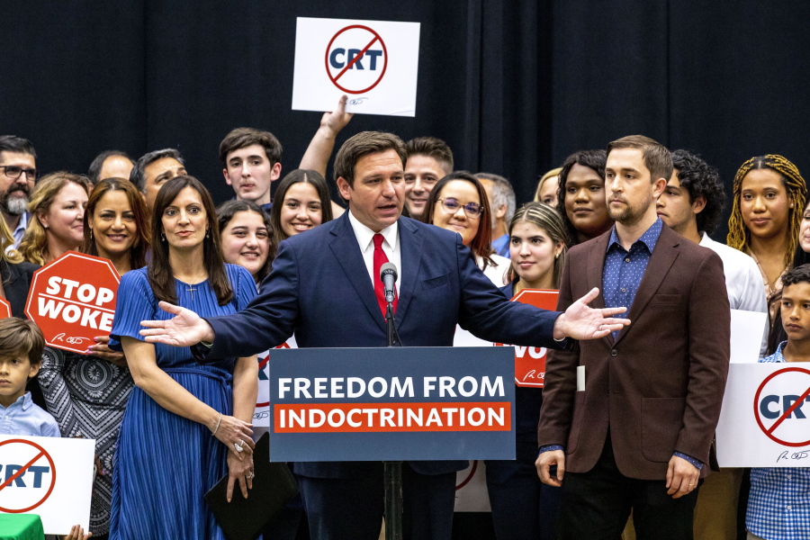 FILE - Florida Gov. Ron DeSantis addresses the crowd before publicly signing HB7, "individual freedom," also dubbed the "Stop Woke" bill during a news conference at Mater Academy Charter Middle/High School in Hialeah Gardens, Fla., on Friday, April 22, 2022. As Republicans and Democrats fight for control of Congress this fall, a growing collection of conservative political action groups is targeting its efforts closer to home: at local school boards. DeSantis endorsed a slate of school board candidates, putting his weight behind conservatives who share his opposition to lessons on sexuality and what he deems critical race theory. (Daniel A.