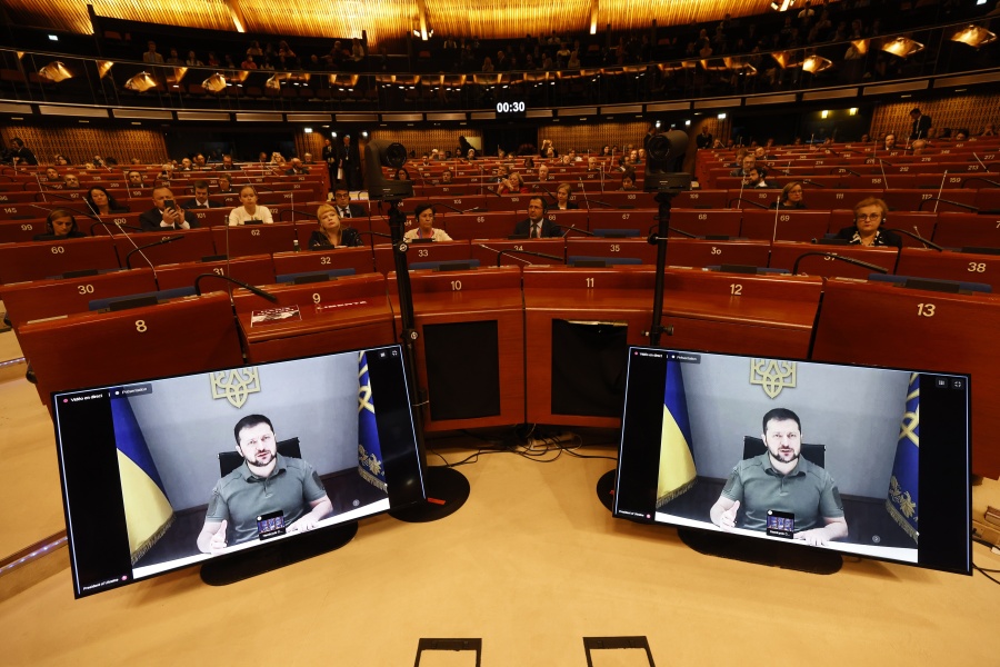 Ukrainian President Volodymyr Zelenskyy speaks during a video address to the European Council, Thursday, Oct. 13, 2022 in Strasbourg, eastern France. Ukraine's capital region was struck by Iranian-made kamikaze drones early Thursday, officials said, sending rescue workers rushing to the scene as residents awoke to air raid sirens for the fourth consecutive morning following Russia's major assault across the country earlier this week.