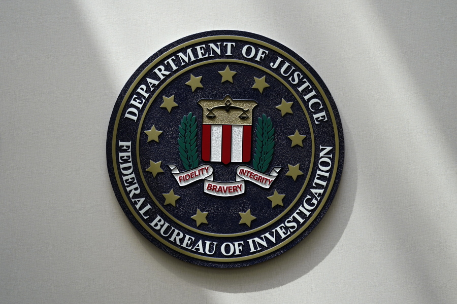FILE - An FBI seal is seen on a wall on Aug. 10, 2022, in Omaha, Neb. The FBI estimates violent crime rates didn't increase substantially last year, though they remained above pre-pandemic levels, according to annual crime data released Wednesday, Oct. 6.