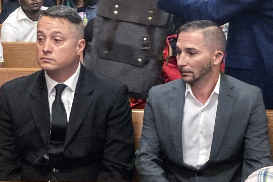 Jacob Runyan, left, and Chase Cominsky, sit in court as they are arraigned, Wednesday, Oct. 26, 2022, in Cleveland. The two pleaded not guilty to cheating and other charges in a lucrative fishing tournament on Lake Erie in the end of September where they were accused of stuffing five walleye with lead weights and fish filets.