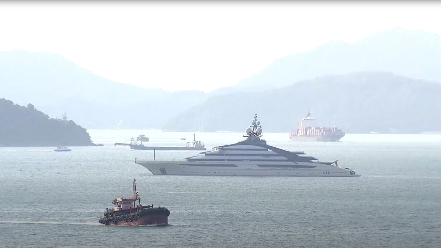 FILE - In this image taken from a video footage run by TVB, the megayacht Nord, center, worth over $500 million, is seen off Hong Kong Island outside Victoria Harbour on Friday, Oct. 7, 2022. The Nord, linked to sanctioned Russian tycoon Alexey Mordashov, left Hong Kong for South Africa Thursday, Oct. 20, 2022, nearly two weeks after the U.S. chastised the city for operating as a "safe haven" for sanctioned individuals.