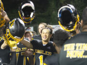 Hudson’s Bay junior Rafael Bauman (1) celebrates with his teammates after the Eagles’ 28-21 win over Woodland on Thursday, Oct. 13, 2022.