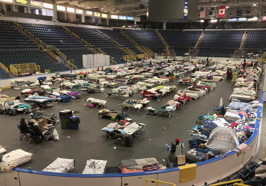 Cots cover the floor of Hertz Arena, an ice hockey venue that has been transformed into a massive relief shelter, in Estero, Fla., on Saturday, Oct. 8, 2022. More than 500 people were still housed at the arena more than a week after Hurricane Ian struck the southwest Florida coast.