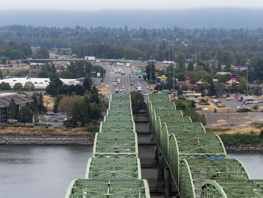 Cars travel along the Oregon side of I-5 and the Interstate Bridge on Wednesday, Oct. 5, 2022, as seen from the top of one of the northbound bridge lift towers.