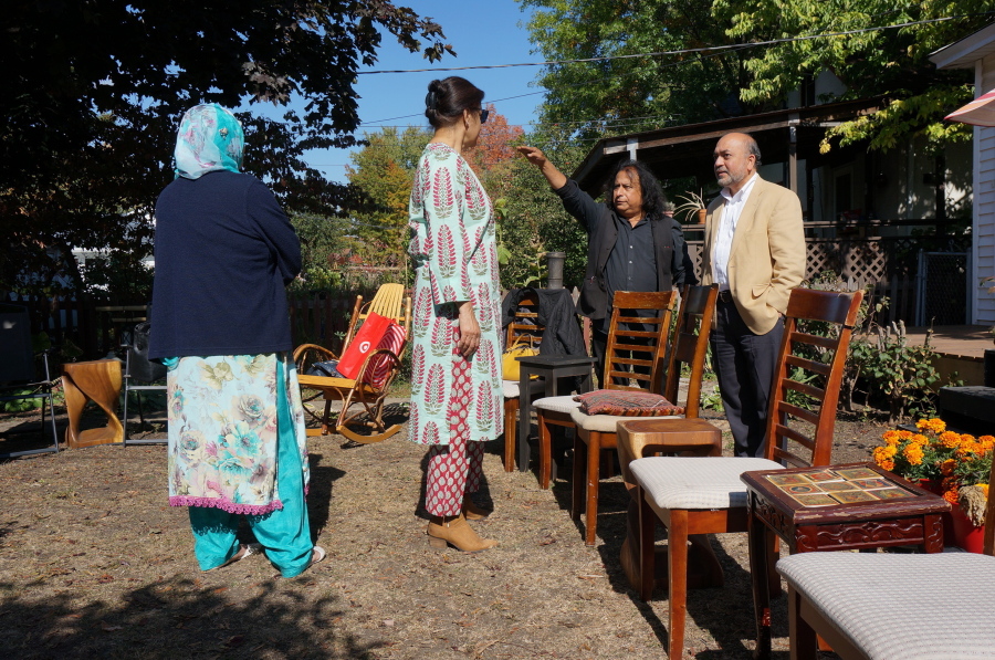 Zafar Siddiqui, right, and other members of the "India Coalition" group gather Oct. 9 at the Minneapolis home of Dipankar Mukherjee, second right, and Meena Natarajan. The group - representing believers in different faiths as well as atheists - meets monthly to discuss how to prevent religious tensions in India from spreading to the Indian diaspora in the United States.